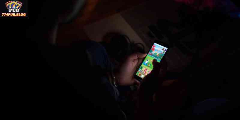 Player enjoying mobile online casino experience at night